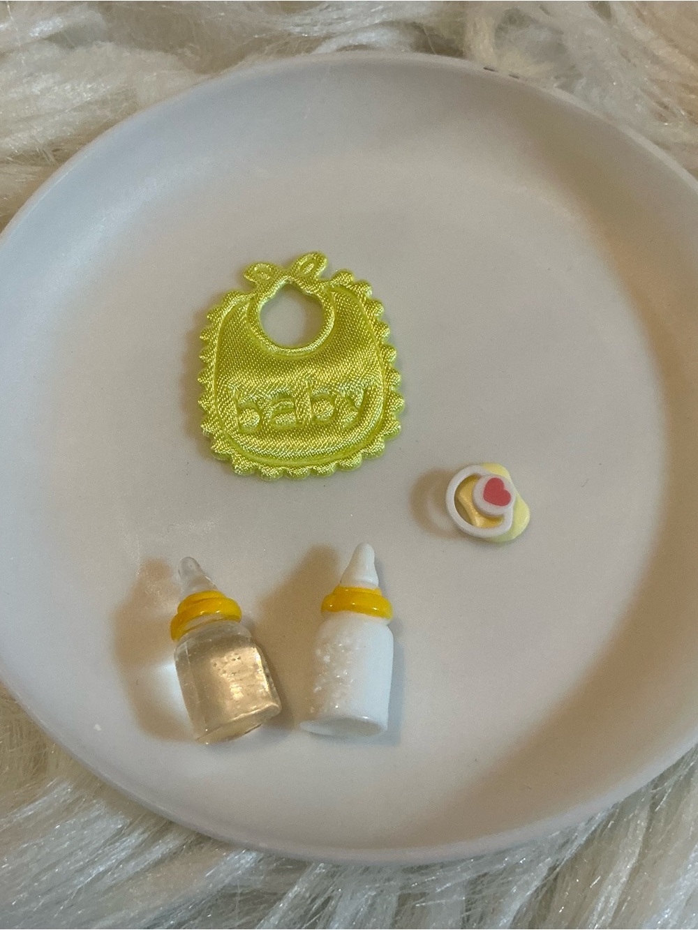 4pc miniatures: baby bib, two bottles and a pacifier